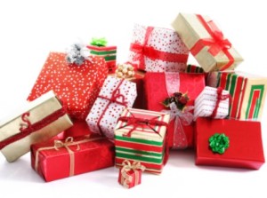 A pile of Christmas gifts in colorful wrapping with ribbons.